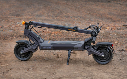 Black electric scooter on a dirt surface